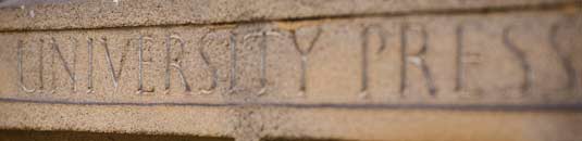 An image showing a wooden door carved with the words 'University Press'