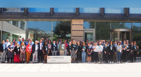 FLIP+ members stand outside the Triangle building for a group photo at the FLIP+ global e assessment event 2023 held in Cambridge