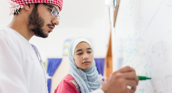 Arabic teenagers at whiteboard