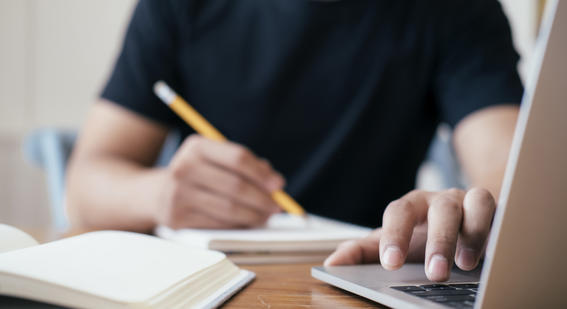 Man typing on laptop