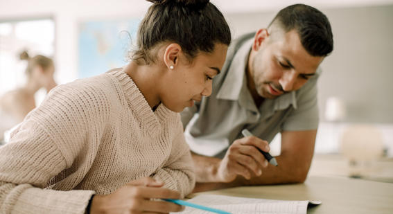 Teacher talking to student 