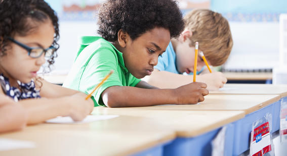 Children studying at desks