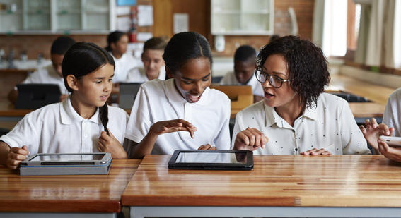 Students on ipads with teacher