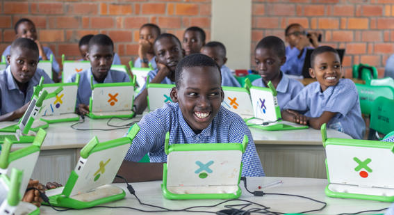 Children using laptops in class in Rwanda