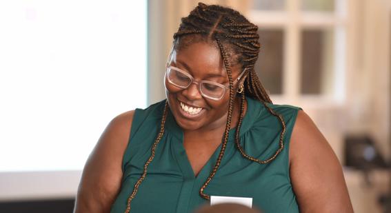 Tutor from Open Development Education smiles during class