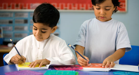 Two young boys learning