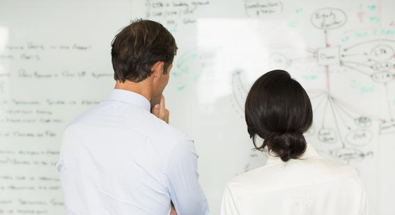 Teachers looking at whiteboard