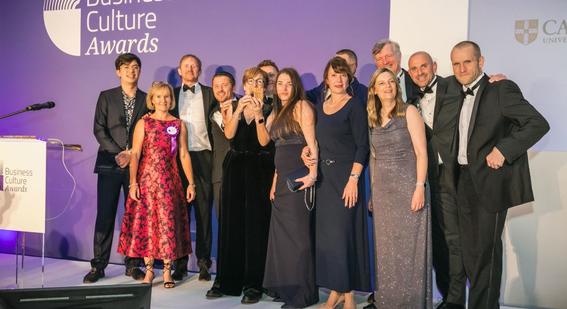 Hosts Phil Wang & Cath Longfield with our team members Guy Nicholson, Martyn Thompson, Janet Scotcher, Damian Sikon, Kirsty Smith, Valentina Ceitlina, Rafal Chatkowski, Heather Darwin, David Bulman, Martin Hemmingfield, Simon Butteriss at the Business Culture Awards ceremony