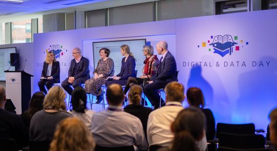 6 panel members seated on stage at the Digital and Data Day 2024 main stage