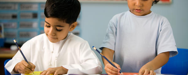 Two young boys learning